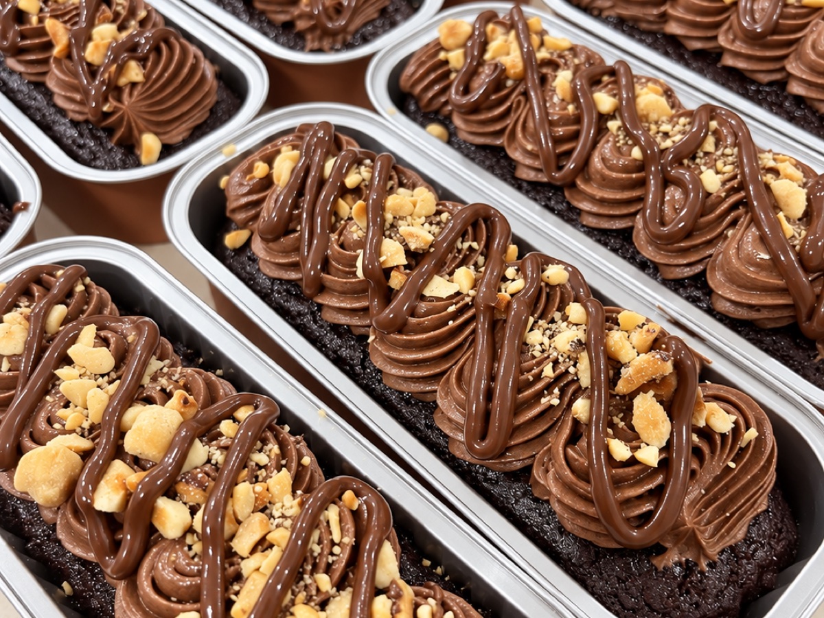 Chocolate mini loaves topped with chocolate buttercream and nuts